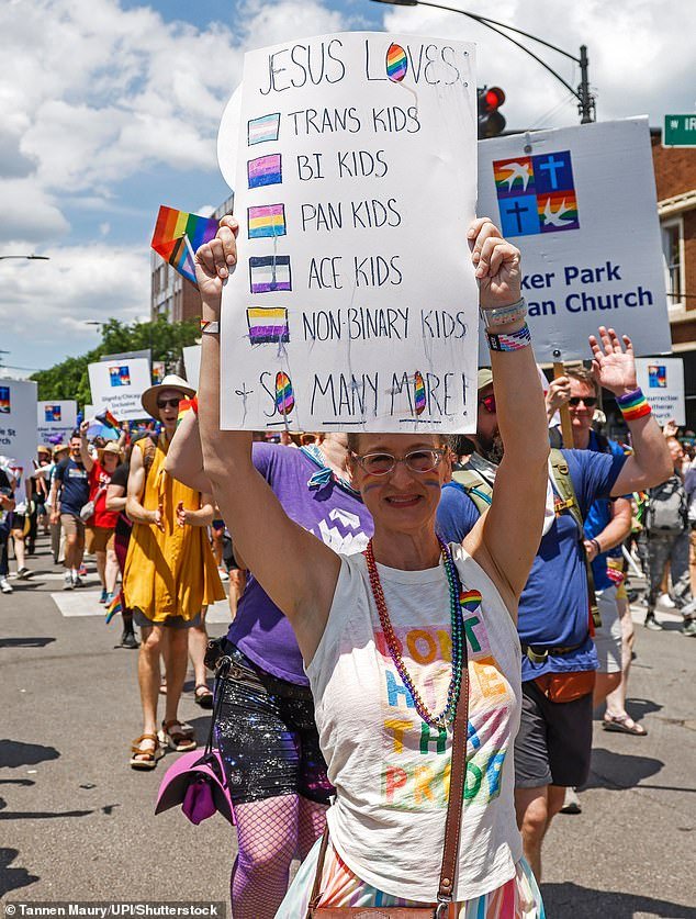 Illinois has now become the latest blue state to rally against the federal government's position, with a high school association revealing it would not comply. Pictured: An attendee at the Chicago Pride Parade in Illinois