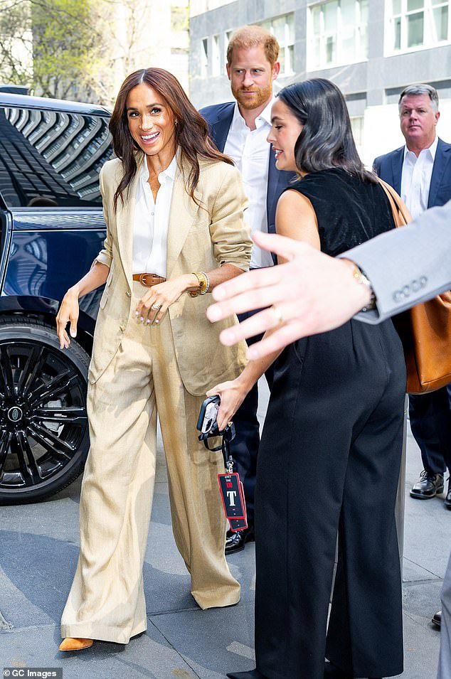 Meghan Markle arrives at the Time 100 Summit in New York City with Prince Harry yesterday