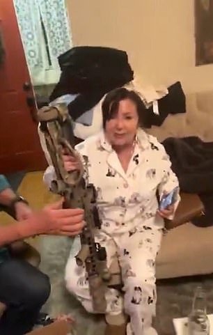 The judge's wife was seen on the alleged gangster's social media brandishing a weapon