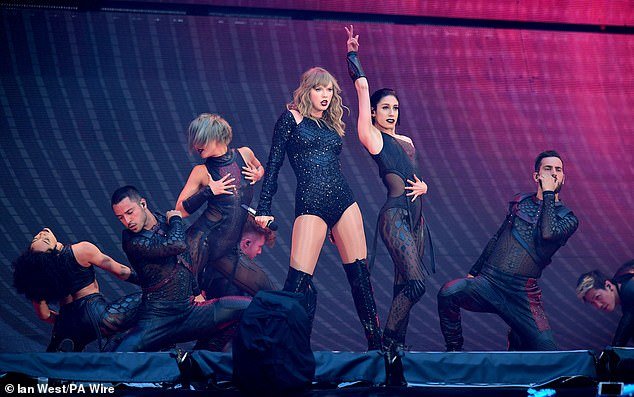 Taylor Swift performing on stage during the Reputation Stadium Tour at Wembley in 2018