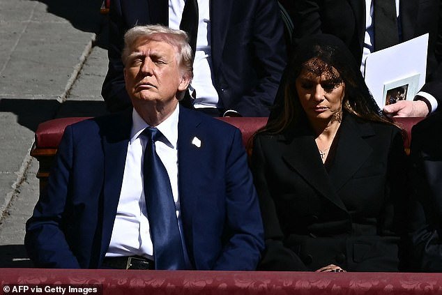 The president, who sat in the front row of hundreds of foreign dignitaries and royalty, donned a mid-blue outfit, adorned with a pin showing the American flag. He paired it with a shiny blue tie