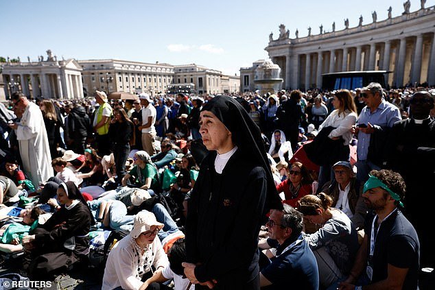 Faithful gather during the funeral Mass of Pope Francis in St. Peter's Square at the Vatican, April 26, 2025