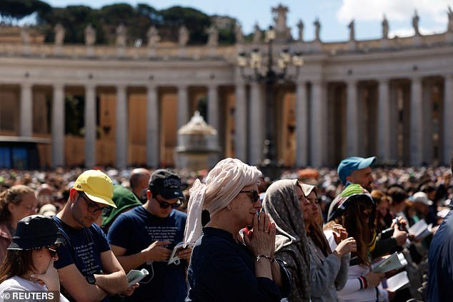 Faithful pray during the funeral Mass of Pope Francis in St. Peter's Square