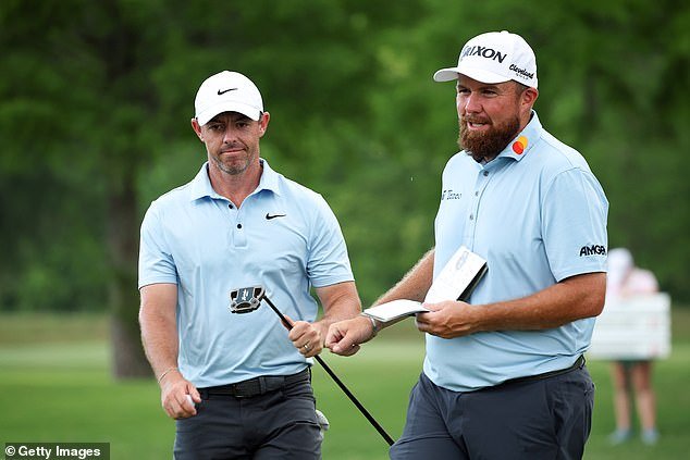 Rory McIlroy of Northern Ireland is congratulated by Shane Lowry of Ireland after a birdie on the 15th green on day three of the Zurich Classic of New Orleans in Avondale, Louisiana