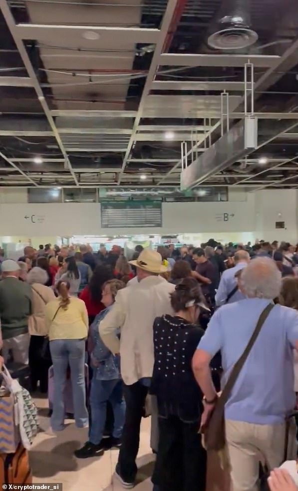 Video showed travellers queuing at a station in Spain amid the power outage
