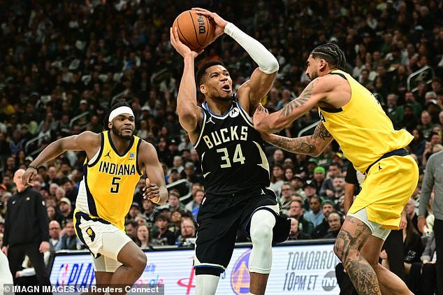 Without his co-star, Giannis Antetokounmpo (34) led the Bucks in scoring, but couldn't win