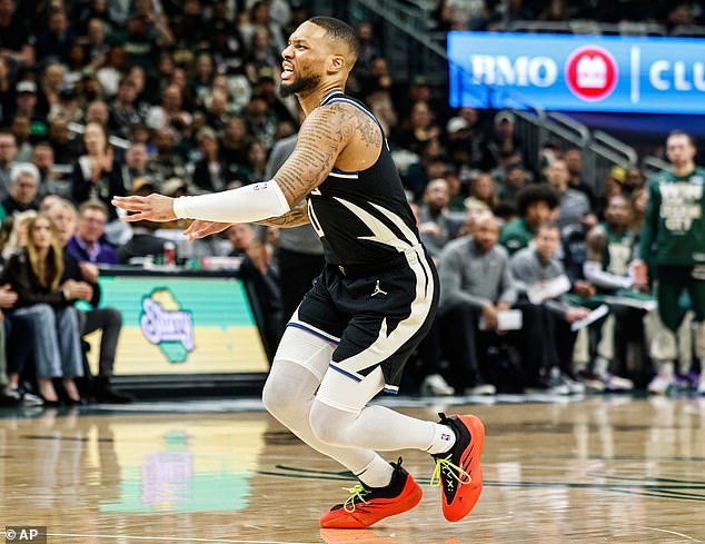 Lillard took an awkward step off his left leg - causing him to fall on the ground and grimace