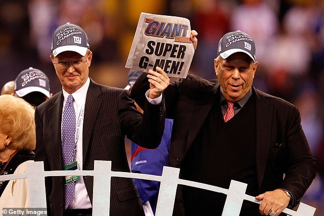 Co-Owners John Mara and Steve Tisch celebrate after the New York Giants defeated the New England Patriots 21-17 to win Super Bowl XLVI at Lucas Oil Stadium on February 5, 2012