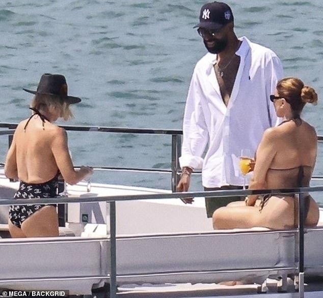 Refreshing herself with a drink from a champagne flute, the The Traitors alumna was clearly in the throes of affection with her new man