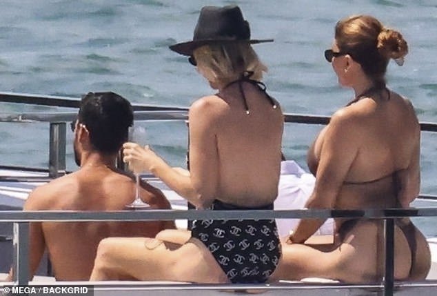 The Real Housewives Of Miami bombshell was accompanied by Real Housewives Of Dubai star Caroline Stanbury (center), 49, who brought her husband Sergio Carrallo (left), 30