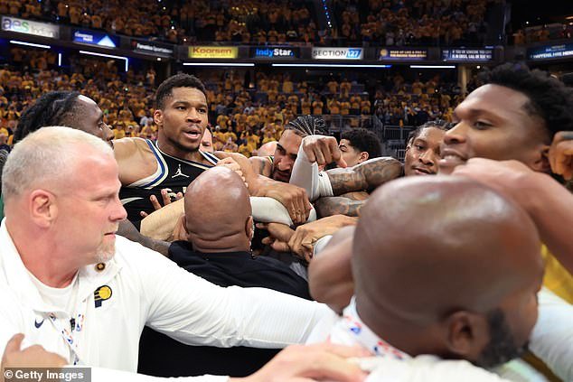 Kevin Porter Jr. (back right) enters the fray as Pacers players restrain Mathurin (right)