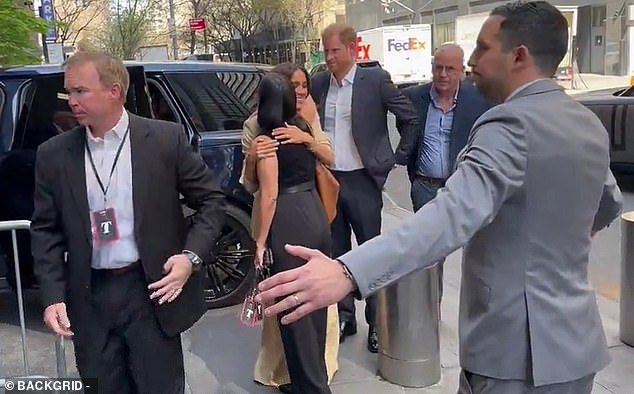 This is the painfully awkward moment Meghan Markle appeared to accidentally ignore a show of affection from Prince Harry as they arrived at the Time 100 summit