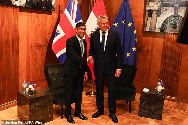 Austrian Chancellor Karl Nehammer welcomes Prime Minister Rishi Sunak to the Federal Chancellery Ballhausplatz in Austria