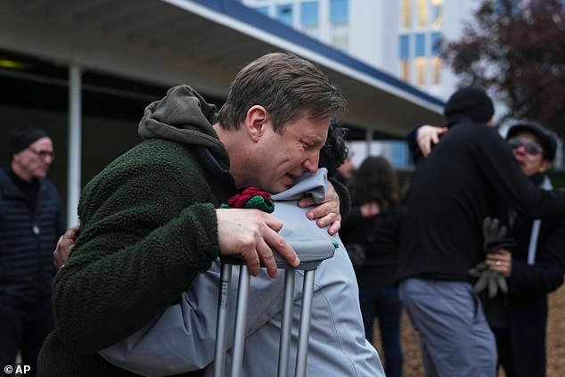 He was consoled by a vigil attendee