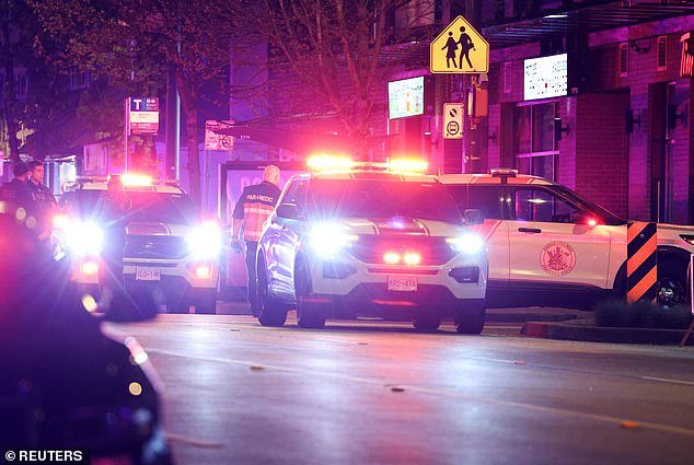 Cops have not yet released an official death toll, referring only to 'a number of people' confirmed to have passed away. Pictured: Paramedics working at the scene