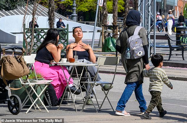 People in the 'hip' district of Norrebro in Copenhagen - which was once considered a ghetto