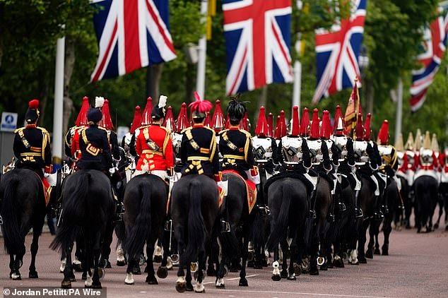 Members of The Blues and Royals Squadron of the Household Cavalry Mounted Regiment ahead of the procession today