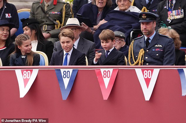 Like father, like son! Prince Louis copying his father's pointing finger gesture at the VE Day celebrations this morning