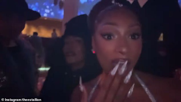 Megan broke Wintour's no cellphone policy to capture moments from fashion's biggest night; Megan seen with Angela Bassett