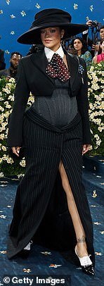 Rihanna confirmed her third pregnancy in a custome AWGE look after arriving nearly an hour late to the event
