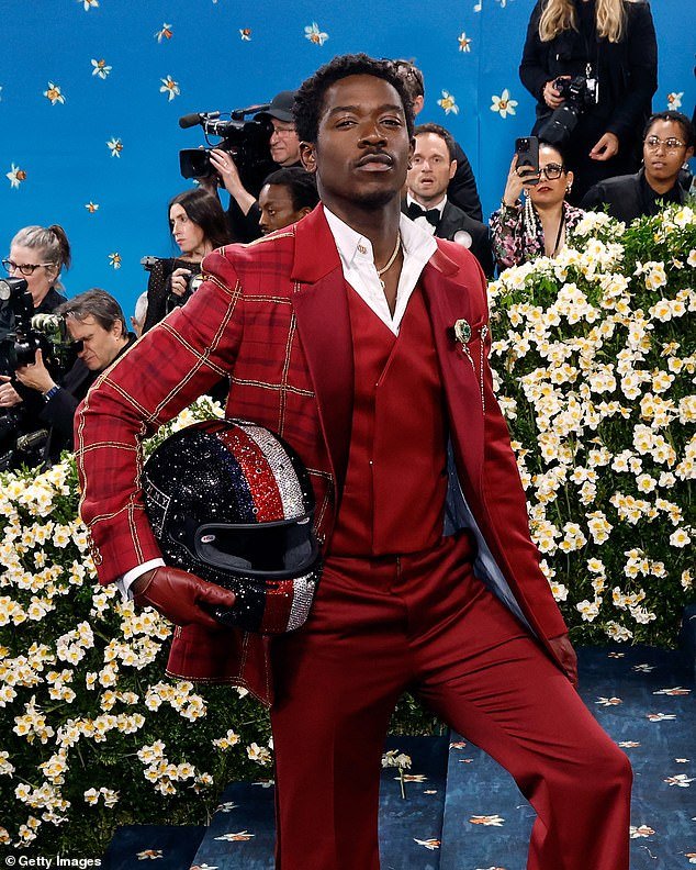 However the star later pulled off the racing suit to unveil a custom red plaid three-piece suit by Tommy Hilfiger, who he became a menswear ambassador for in April 2023