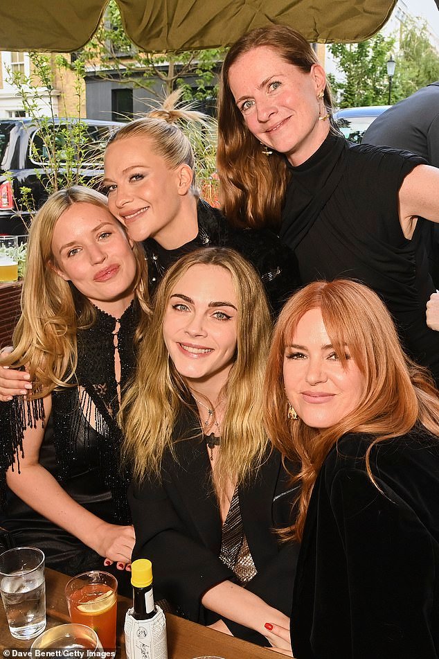 Georgia posed with Poppy, Cara, their sister Chloe Delevingne and Isla Fisher at the pre-drinks reception (L-R)