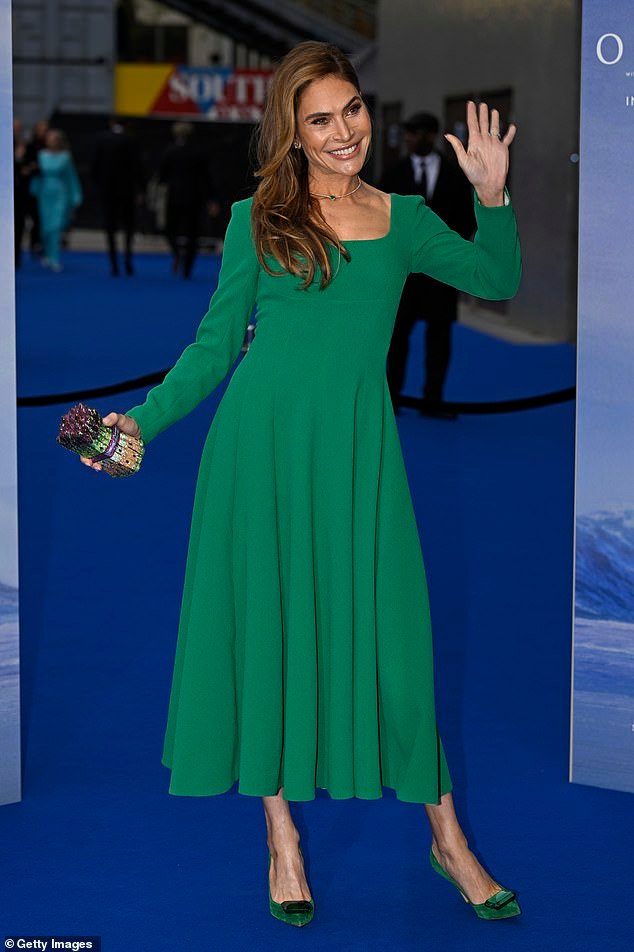 Robbie Williams' wife Ayda Field wowed in a bright green dress and matching velvet heels