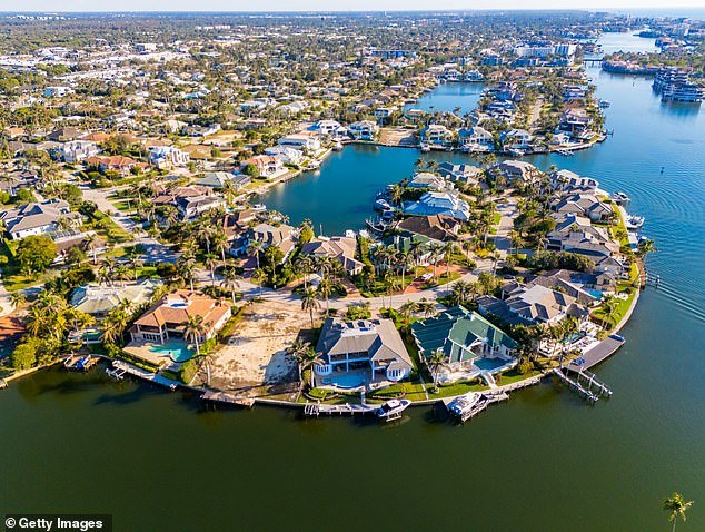 Luxury homes that line the water in Naples have their own boating docks and are gated