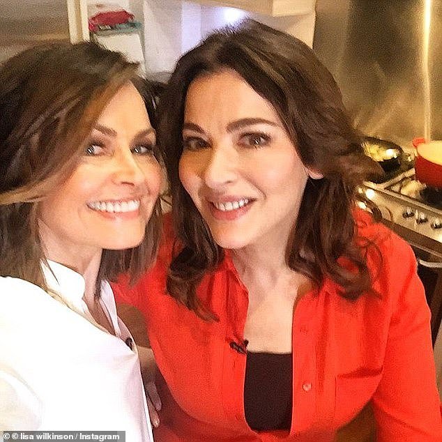 It's customary for guests to bring a dish, but without a kitchen in Sydney to work with, celebrity chef Nigella Lawson (right, with Wilkinson at a previous gathering) brought champagne instead