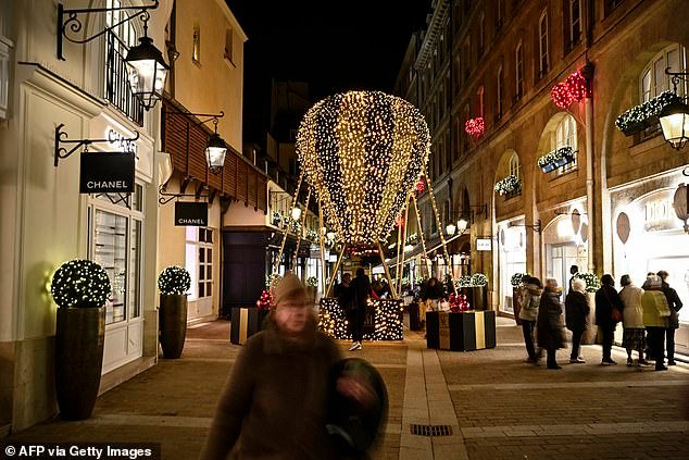 The UK economy has grown faster than that of any major European rival since 2010. Pictured: People walking in Le Village Royal in Paris