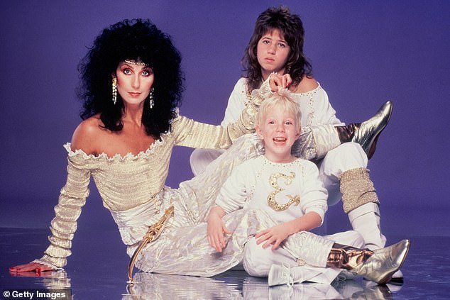 Pictured: Cher with eldest son (now Chaz Bono) and Elijah in 1981