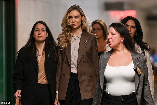 Sokola with her lawyers outside the courtroom on Thursday