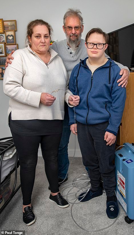 Jemma Walker, 50, with her partner Shaun and son George, who has Down's syndrome