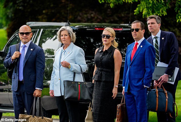 Karoline Leavitt, center, points out President Donald Trump has hired many strong women, including Susie Wiles, the first women to serve was White House chief of staff (pictured at Leavitt's right)