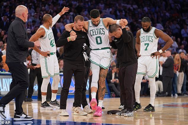 Tatum is carried off the court by trainers and the team is fearing the worst for its best player