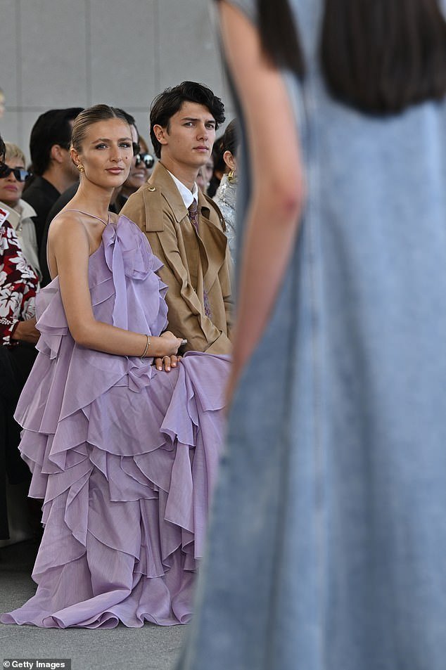 Meanwhile, his radiant girlfriend Benedikte, 24, stunned in a striking purple strapless frill dress from the label