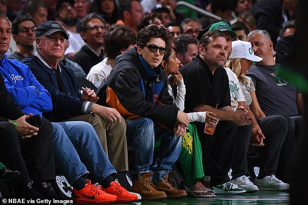The pair were just a few seats down from Timothee Chalamet on a high-profile Celebrity Row