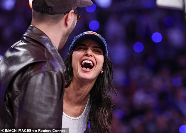 Kendall threw her head back and laughed at something one of her pal's said