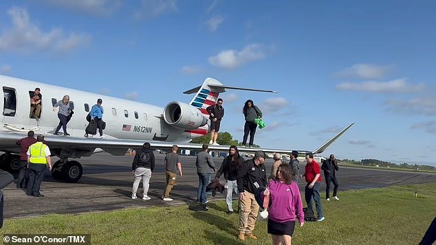 Flight 5406 experienced a 'maintenance issue' after landing at Augusta Regional Airport in Georgia on April 2. Shocking footage captured by Sean O'Conor, who was onboard the aircraft, showed horrified and confused passengers crawling onto the wings of the plane before jumping a few feet down to the ground