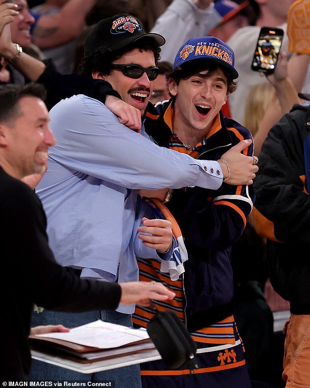 Rapper Bad Bunny (L) and actor Timothee Chalamet (R) celebrate the Knicks victory Friday