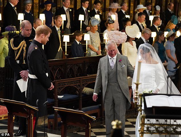 Charles, then Prince of Wales, walks Meghan down the aisle as her own father could not attend