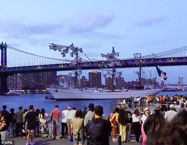 The tops of its three towering masts slammed into the span, partially collapsing as the ship floated in the East River, leaving at least two dead and dozens severely injured