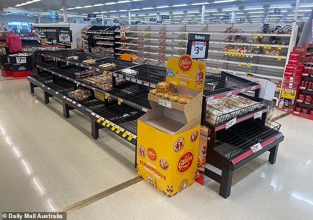Supermarkets shelves have been stripped bare, including the bread aisle at Coles Laurieton