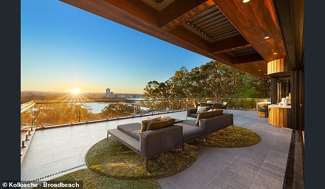 The Copper House features a curved copper façade and panoramic views of Currumbin Beach from every level