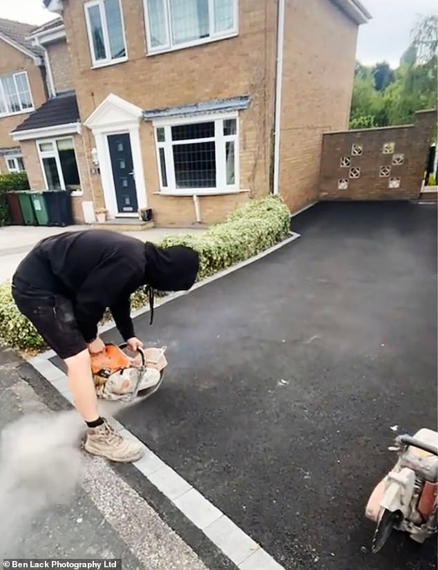 The footage appeared to show a man with a chainsaw tearing into the newly-completed tarmac