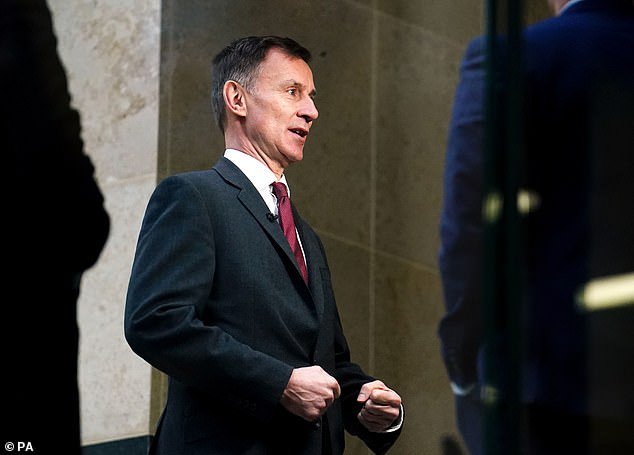 Jeremy Hunt took a veiled swipe at the IMF today after figures showed the British economy flatlined in February
