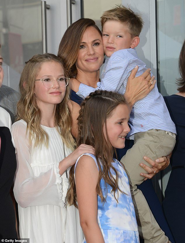 The adults Violet complains about in her essay, who were probably paying for Violet¿s stay in the assuredly luxurious hotel room, focused on the important, immediate and controllable things during the LA fires. (Pictured: Violet with Garner and younger siblings Fin and Samuel).