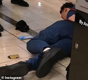 Images circulating social media appeared to show two young men pinned to the ground by police
