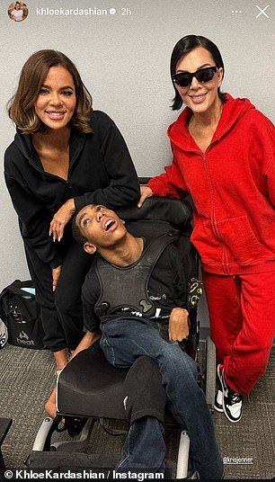 She appeared alongside her third-born child and Amari in two smiley photos, dressed in a red sweatsuit with black and white Nike sneakers
