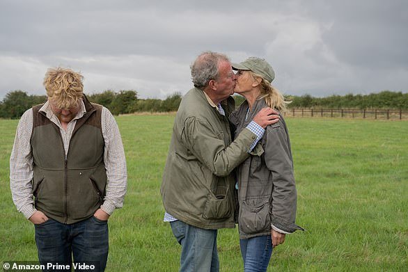 Jeremy kisses girlfriend Lisa Hogan as Kaleb awkwardly averts his eyes